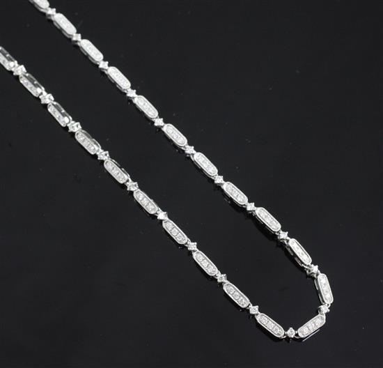 An 18ct white gold and diamond necklace, 17in.